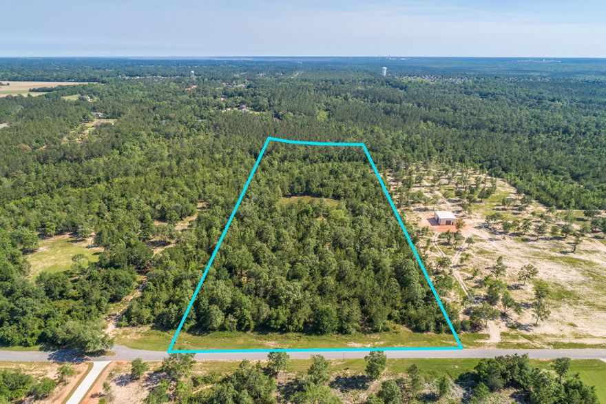 Come build your secluded dream home in a gated community on over 14 acres with a creek running through it. This is wooded uncleared raw land with no improvements just waiting for you to make it your own private oasis. No-Outlet street. No tap fees have been paid. The land has an active transformer ready for hookup, but no electricity has been routed beyond the transformer. AT&T also has fiberoptic routed to the transformer and ready for hookup. Zoned AG-RR which is suitable for horses and small livestock. HOA authorizes hooved animals with the exception of swine. No pigs allowed. Just 10 minutes from 5-points intersection to Publix, shopping and dining. Located just 40 minutes to Pensacola Beach and in desirable Santa Rosa County school district. No Water or sewer available at this time. W