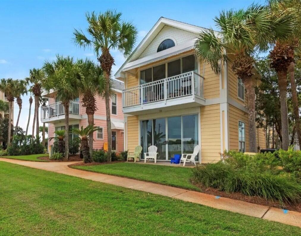 BEST DEAL IN CRYSTAL BEACH with lowered 2024 HOA costs!! This Florida Cottage Home located in the desired Crystal Beach area has two separate ''Lock-Out'' Units and is right across the street from from the Gulf of Mexico and our incredible White Sand Beaches. This Home is perfect for someone looking for a 2nd Home Retreat or as an Investment Short-Term Rental. Each Unit (A & B) consists of one Bedroom, one full Bathroom, and a Bunk Room as well as a Kitchen, Living/Dining area and a private Balcony and Patio. This Home will be delivered fully furnished/rental ready with proven Rental Income delivering a really nice Return on Investment. Nantucket Cottages has a Community Pool and Laundry Facility along with having two convenient Beach Access locations.!