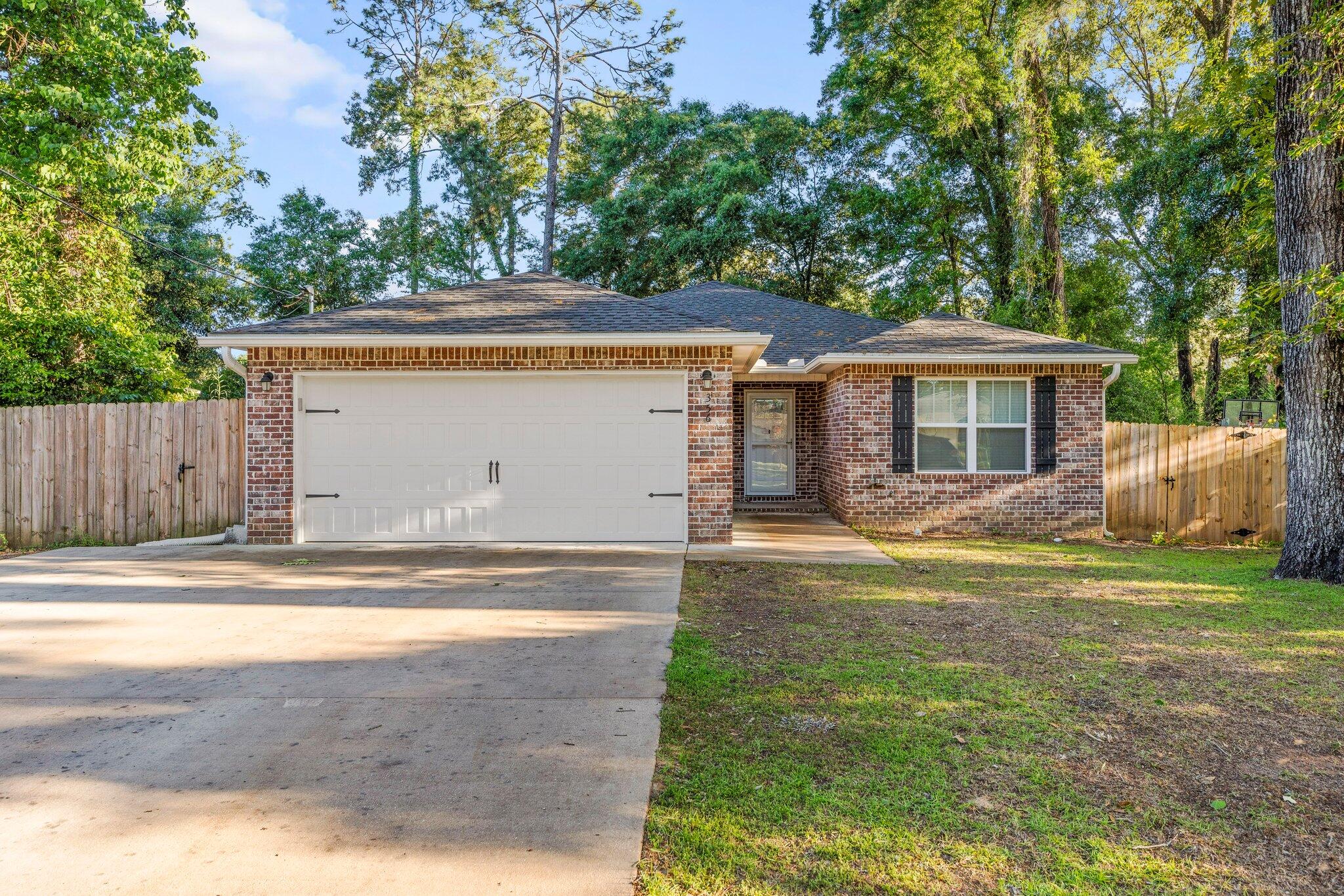 This beautiful brick, single owner home is ready with all the updates you want! Newly constructed in 2020 you won't have to worry about age of roof, water heater, or HVAC saving thousands of dollars in possible replacements. Appliances are still covered under the original 10 year warranty.  Conveniently located two lots down from Bob Sikes Elementary School! Granite counters, stainless appliances and a tile floor make spending time in the kitchen a pleasure. With an open view of the living area that boasts LVP floors, you can entertain easily. Expand that entertainment with quick access to the large privacy fenced backyard to include a fire pit and additional storage shed. The large primary bedroom with its own en suite bathroom and walk in closet add comfort when it's time to unwind for the day. With all the conveniences of a newer home, ease to schools and shopping, all while nestled in a mature neighborhood, this one is certain to check all the boxes!