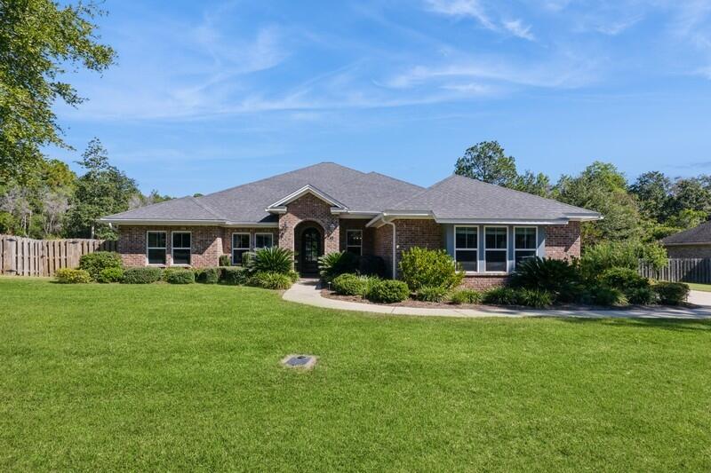 Come take a look at this absolutely stunning 4-bedroom, 3-bathroom custom-built home in Hammock Bay! Built in 2016, this home is over 3200 sq. ft. and offers a large screened in porch with an outdoor kitchen. The open and inviting kitchen includes quartz countertops, a Wolf range and oven as well as a wall oven and microwave. This home also includes a convenient tankless water heater with recirculation and a five-ton HVAC system. The sophisticated design of the master suite features abundant space with a sitting area, a sizable bathroom including a tile shower, soaker tub, and a spacious walk-in closet. This lot encompasses two-thirds of an acre allowing for ample room for outdoor activities. Echo Cove is a dead-end, Cul-de-sac street, with two trail heads to Hammock Bay Nature Trails.