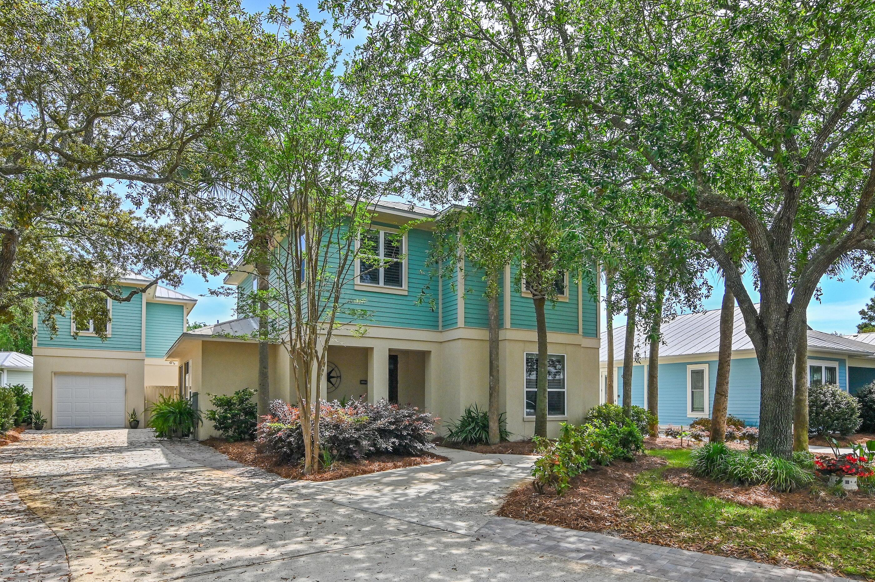 Not your typical Crystal Lake home--this is the larger floor plan with space to gather, relax, and make memories in Sandestin(r) Resort! Featuring a rare heated & cooled garage, oversized driveway for 5+ cars, and a private carriage house with studio and full kitchen--perfect for guests or extended stays. Inside, enjoy an updated kitchen with gas stove, beautiful baths, and main-level suite. Upstairs offers more spacious bedrooms with built-in storage. The screened porch ,upgraded landscaping with private, fenced backyard invite connection or quiet time. No short-term rentals. Live full-time or vacation in resort-style comfort a golf cart ride away including golf, beach, tennis, pickleball, marina, dining & shopping & more!