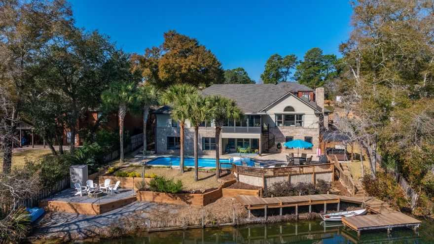 Welcome to this exquisite 6-bedroom, 4-bathroom home nestled in the heart of Rocky Bayou Country Club Estates on the shores of Lake Henderson. This breathtaking home where tranquility meets modern luxury features 4,116 square feet of living space adorned with elegant finishes and an abundance of natural light.This is a home where you can both relax and entertain. The heart of the home features a chef's kitchen equipped with top-of-the-line appliances, large island, motorized blinds and lake views from every window. The kitchen seamlessly transitions to a generous living area with a fireplace overlooking the beautiful lake where nature can be seen firsthand. You will love having your morning coffee while looking at otters, blue herons, soaring bald and golden eagles.More .... The primary suite offers a serene escape where you will awaken every morning to stunning tranquil lake views. The spa-like bathroom will take your breath away with an art-inspired soaking tub, a gorgeous chandelier, walk-in shower with shaving niche and his and her closets.

The main floor also has a flex room, 3 additional bedrooms, the first of two laundry rooms and the unmistakably beautiful dining room. Lastly, you can relax and enjoy the 4-season room that provides secondary access to the pool level.

As you descend the stairs to the lower level where every room has views of the lake, you'll be taken aback by the expansive living area, a second kitchen perfect for entertaining outdoors, a second laundry room and two exceptionally large bedrooms with large walk-in closets, built-ins and newly renovated on-suites. The owners also have added what every homeowner needs, an abundance of storage which you will have to see to believe.

At this exclusive residence, be pulled away by the allure of the outdoor living, an entertainer's dream, set against the backdrop of the picturesque lake and beautiful palm trees. Here you can relax and entertain in the sparkling pool and hot tub, make smores in the firepit area, sunbath on the expansive deck, fish off the newly renovated dock and stairs or kayak on the lake.

Completing this exceptional property is a spacious 3-car garage, with professionally installed epoxy flooring and new hurricane-rated garage doors.

The owners have also updated things not seen in the photos which include: a brand-new roof (2025), foam insulated attic space, including the garage, recessed lighting with dimmers, motorized blinds on the front of the house and so much more. This house also comes with a full-house generator.

Once you decide to leave the house, the Rocky Bayou Country Club with renowned golfing, a swimming pool and club house is minutes away by golf cart with access just down the street. You are also just minutes from shopping, beautiful emerald water beaches, Eglin and Hurlbert Air Force Bases, Duke Field, 7th SFG and everything else the area has to offer.

Don't miss this rare opportunity to own a truly one-of-a-kind home on peaceful Lake Henderson in the heart of the highly sought after Rocky Bayou Country Club Estates.