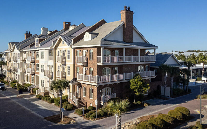 Stunning three-story, all brick, luxury corner unit townhome in the desirable Prominence neighborhood. Features a main house with 4 bedrooms, elevator access to all 3 levels, plus a carriage house with an additional bedroom over a two-car garage, and a private courtyard connecting the two. Each of the 5 bedrooms has access to covered balcony & en-suite bath. Also includes: ICF construction (energy efficient & noise reducing), Geothermal heating & cooling, central vac throughout. Just outside of this amazing home is all of the conveniences of Prominence and The Big Chill where you'll find restaurants, shopping, family activities, concerts, movies, and more. Community amenities include two pools, a fitness center, and seasonal beach shuttle service, See more about Watersound Club This property is adjacent to Watersound and the Watersound Club by St. Joe. This is a amazing opportunity to have a Beach Club right next-door. Membership includes Tennis /Pickleball Wellness center Pool, Lazy River, Restaurant and Bar, Golf and Beach Club w/chair set-ups. All you need is your sunglass and bathing suit to enjoy the beautiful sugar sand and emerald green water of the Gulf Coast. 