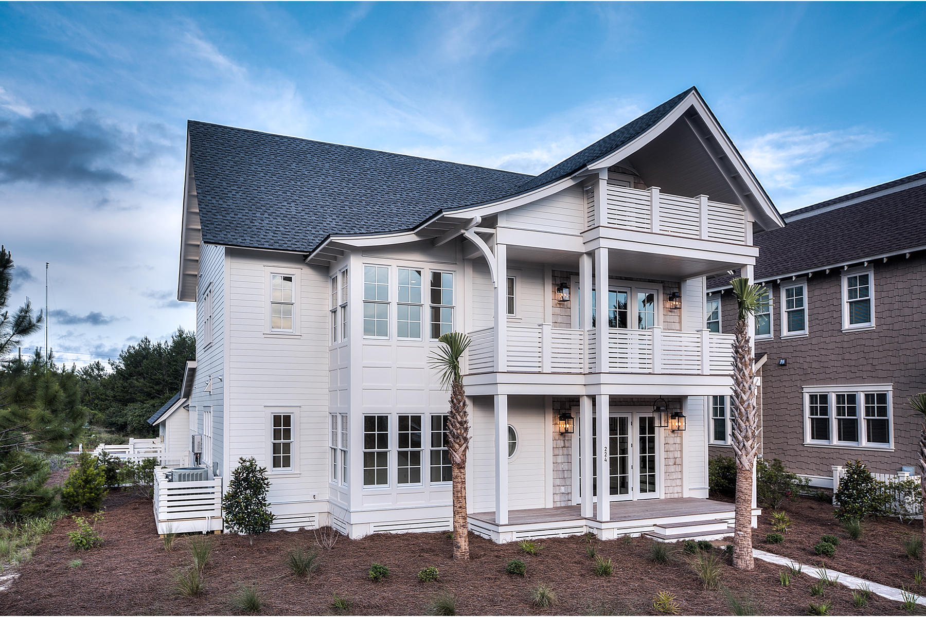 This stunning home in the Peninsula at Watersound Beach, designed by revered Architect, Ron Domin, avails itself of sight to both Camp Creek Lake and the Gulf of Mexico. Natural light bathes the interior living spaces which are adorned by the wire brushed, oak wood floors and custom, solid wood planking walls throughout. An open and spacious living room opens up to the kitchen and dining rooms, which feature Carrera Marble counter tops, thermador appliances and antique-finished, local Cypress wood beams. Completing the first floor is a spacious guest bedroom lined with windows.