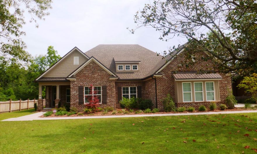 MOVE-IN READY! LOCK YOUR INTEREST RATE TODAY! The new Hart III floor plan, large upstairs bonus area/bedroom with full bath and walk-in closet. This will quickly become a best seller. Home will come with 9' ceilings, very good quality, semi-custom cabinets, tiled wet areas, walk-in pantry, granite counters and a covered lanai. Home will have stainless steel appliances excluding fridge/washer/dryer, oil rubbed bronze package, brick fireplace in living area, French doors leading outside, crown molding and case windows, wood faux blinds (entire home), upper cabinets in laundry, desk with cabinets, ceiling fans, 3 car garage, stair rail with oak, lot cleared, tiled master shower and bath, stained glass double doors in study, pool alarm and pool power, extra electrical outlets, Mill Creek Farms