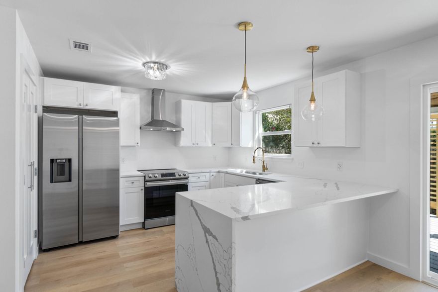 MOVE IN READY! House shows brand new with so many upgrades! Great curb appeal on this 3 bed 2 bath, one story residence with all new sod, garage door, shutters and front door. Completely updated interior includes all new LVP flooring, interior doors and hardware, baseboard trim and door casings, fresh paint, ceiling fans, light fixtures, and recessed lighting in living room. Popcorn ceilings have been removed and refinished. Kitchen boasts all new stainless steel appliances, hood vent, soft close cabinets and drawers, faucet/sink, quartz countertop with stunning waterfall edge and pendant lighting. Master bedroom offers a private retreat with two large windows letting in natural light, trey ceiling, spacious walk-in closet and en suite master bath with all new double vanity, porcelain tile floor, shower and toilet. Additional full bathroom also highlights new shower/tub combo, vanity and toilet. Brand new sliding glass door off dining area leads to new deck which is partly covered and showcases a charming pergola. 2021 roof, AC replaced in 2022. Tankless hot water heater. Low maintenance yard with sprinkler system in place. No HOA. 4.2 miles to Eglin AFB. 9.8 miles to Hurlburt Field. Convenient location to shops and restaurants.