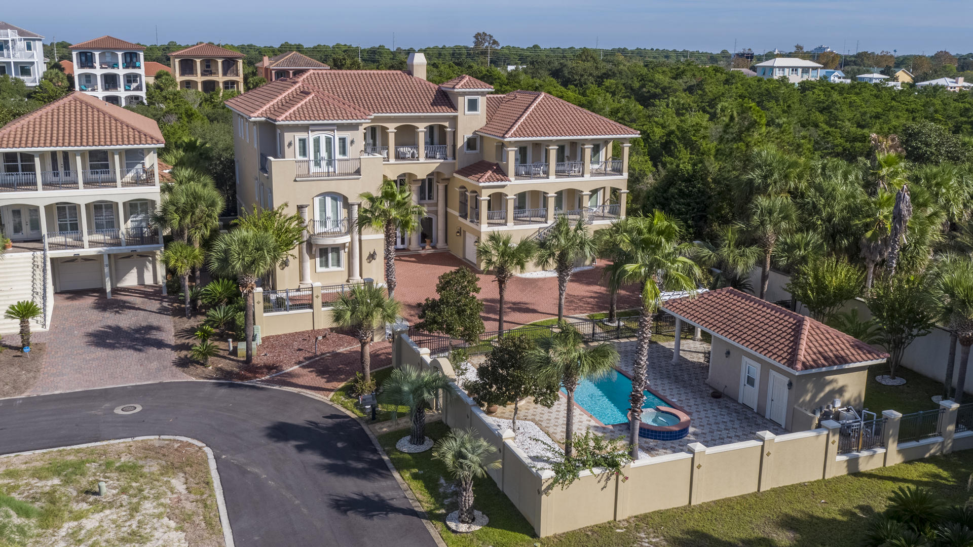 A grand masterpiece, this gorgeous custom Mediterranean style gated estate combines fine craftsmanship and skillful design. Sited on three highly-desirable lots, the 9,100 square foot residence is in an enviable position in a quiet coastal setting discreetly tucked off Highway 98 in Miramar Beach, Florida. Central to the very best of the Emerald Coast, both Destin's vibrant harbor and the relaxed sophistication of South Walton are only moments away. Even closer, dedicated beach access, which is readily available down a dead-end lane and with no major roads to cross. Gulf breezes scented with magnolia blossoms can be relished throughout the immaculately maintained grounds or from one of four large Gulf view balconies.