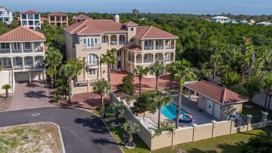 A grand masterpiece, this gorgeous custom Mediterranean style gated estate combines fine craftsmanship and skillful design. Sited on three highly-desirable lots, the 9,100 square foot residence is in an enviable position in a quiet coastal setting discreetly tucked off Highway 98 in Miramar Beach, Florida. Central to the very best of the Emerald Coast, both Destin's vibrant harbor and the relaxed sophistication of South Walton are only moments away. Even closer, dedicated beach access, which is readily available down a dead-end lane and with no major roads to cross. Gulf breezes scented with magnolia blossoms can be relished throughout the immaculately maintained grounds or from one of four large Gulf view balconies.