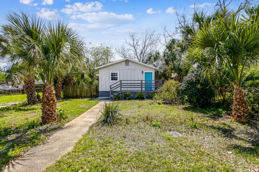 Adorable Florida cottage ready for investors in Downtown Pensacola! This home features a new roof in 2021, electric A/C 2022, new stainless steel fridge and stove, new water heater, new windows, new closet doors, fresh paint both interior and exterior and new wood at the front bottom of the house. This Florida cottage is your blankslate and ready for personal touches; neutral tile flooring throughout, and open kitchen/living area floor plan. Washer and dryer hookups are located inside the home. The backyard is fenced and lush with beautiful palm trees.