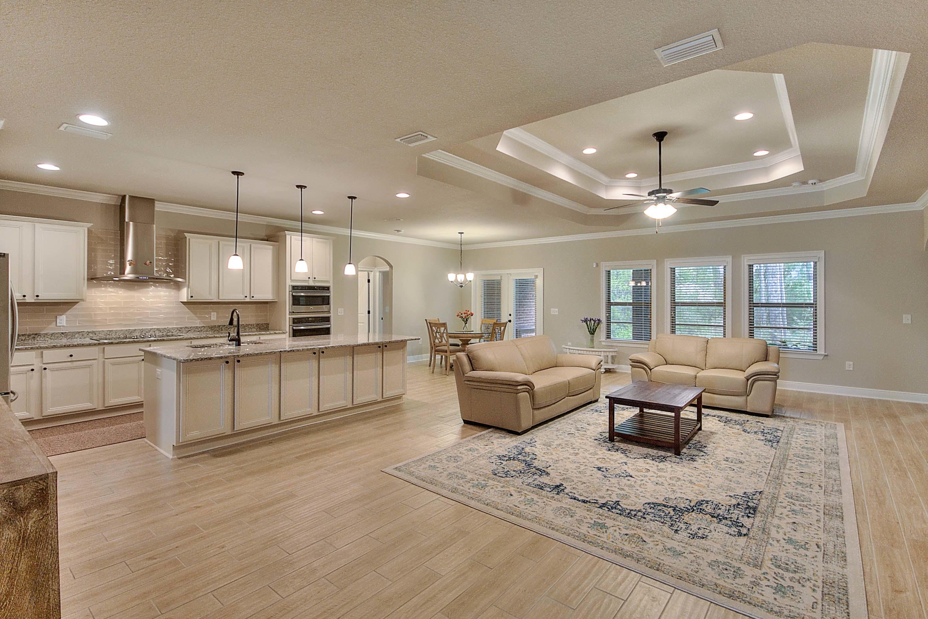 Are you searching for an immaculate 3000+ sqft home built in 2017 with 43,000 dollars worth of builder upgrades? If so your search is over. This enhanced Mckenzie plan is an open split floor plan excellent for entertaining and includes an office/study with double french glass doors that could be used as a 6th bedroom. The large family room featuring recessed lighting and trey ceiling flows into a spacious kitchen with matching GE Profile stainless steel Advantium upgraded appliances including a chimney vent hood. Kitchen also features a large center island. Granite counter tops are found in the kitchen and all bathrooms. Most rooms feature ceramic tile with willow bend wood look. Professionally painted accent walls and color toned painted cabinets. There is a screened in back .porch with a wooded view and a two car garage. ADT security system with camera and a Ring doorbell with communication. Exterior Cherry-Wood brick with matching vinyl trim and shutters. There are whole house rain gutters and a landscaping irrigation system. You owe it to yourself to see this one.