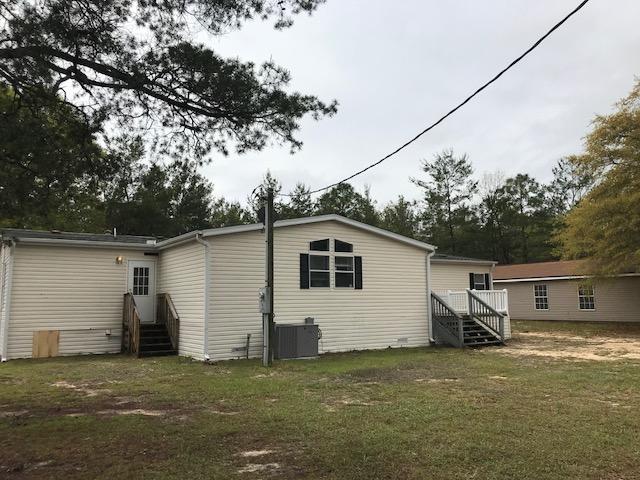 Amazing 5 bedroom, 3 bath manufactured home on 10 acres available for sale in Crestview! Split floor plan, large master with huge walk in closet, double vanity, garden tub, and separate shower. Fire place, wet bar, and HUGE kitchen with an island, granite counter tops, and tons of cabinet space. Fresh paint, new light fixtures, new laminate floors, and more! Property will be getting new carpet in the bedrooms and new stainless steel appliances (on order). Back yard features a fantastic storage/workshop as well as another small storage shed. This won't last long! Vacant and easy to show.