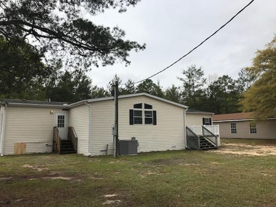 Amazing 5 bedroom, 3 bath manufactured home on 10 acres available for sale in Crestview! Split floor plan, large master with huge walk in closet, double vanity, garden tub, and separate shower. Fire place, wet bar, and HUGE kitchen with an island, granite counter tops, and tons of cabinet space. Fresh paint, new light fixtures, new laminate floors, and more! Property will be getting new carpet in the bedrooms and new stainless steel appliances (on order). Back yard features a fantastic storage/workshop as well as another small storage shed. This won't last long! Vacant and easy to show.