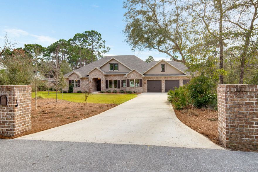 Beautiful executive home in Bluewater Bay. Located on a very private 1 acre lot with SPRING Fed creek. Featuring over 4200 sf of heated and cooled space and 5700 sf under roof with three car garage. Downstairs, you'll find the master, with direct access to a large screened porch, two additional bedrooms, kitchen, dining and an office. The upstairs has two super sized bonus rooms that are currently used as a den, billiard room, ping pong room, and fitness area. The home is built to the most recent code and has hurricane and energy saving features such as hurricane rated impact resistant windows, two tankless hot water heaters, and foam insulation in ceilings and walls. Features include 11' ceilings, granite counter-tops, craftsman trimmed windows, crown molding, pot filler,