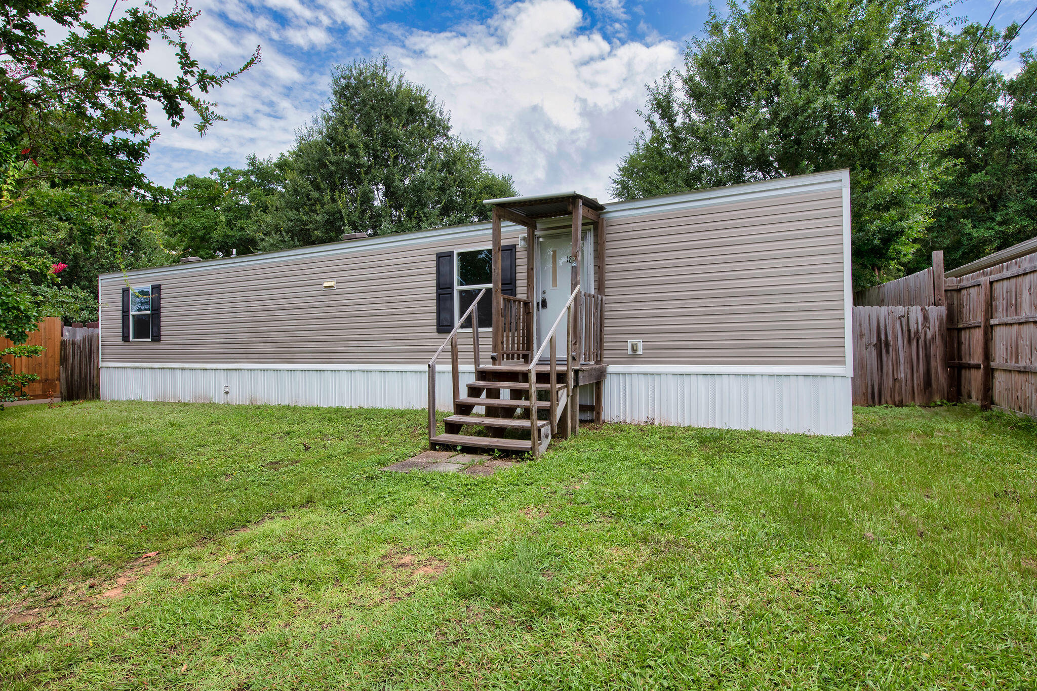 Immaculate and move-in ready! This well-maintained 2019 manufactured home offers 2 spacious bedrooms, 1 full bathroom, and a bright, open living space perfect for comfortable everyday living. Situated on a quiet street, the home features two large storage sheds, providing ample room for all your tools, toys, or hobby gear. Enjoy the convenience of being just a short drive from Navarre Beach, Okaloosa Island, and multiple military bases--an ideal location for military personnel, beach lovers, or anyone seeking peaceful coastal living with easy access to local amenities. Whether you're looking for a primary residence or a low-maintenance second home, this one checks all the boxes!