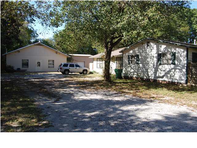 Perfect investment property, Zoned Residential and Commercial!! This unique property has a lot to offer to the right buyer. The half acre property includes a 4br, 2 ba, 2000+ sqft single family home and a 3,700 sqft office/warehouse building. The single family home is ready to move in. It has large open living area and large kitchen. Nice private deck off the back of the house. The office/warehouse building has 2,700 sqft of heated and cooled office space and 1,000 sqft of warehouse storage areas with built in shelving. On the right side is a single roll-up door for loading and unloading. Please call for more information.