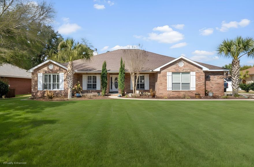 ||  OPEN HOUSE THIS SATURDAY MARCH 7th 12-2pm  ||  What if you could travel back in time and snag a mortgage rate from a few years ago? This home offers a rare VA-assumable loan at a staggering 2.25% interest rate (on a balance of roughly $445,000). To put that in perspective, assuming this loan will save you over $1,100 per month compared to current market rates. That's over $13,000 a year staying in your pocket instead of going to the bank.  This solid brick fortress features 4 dedicated bedrooms plus 2 massive flex rooms, effectively giving you a 6-room sanctuary. Whether you need a high-end home office, a formal dining space, a workout room (or even two additional bedrooms), you finally have the space to make it happen. The interior feels light and airy with soaring high ceilings and brand-new LVP flooring throughout the main living areas. The kitchen serves as the command center with a functional island, granite countertops, and stainless steel appliances, all flowing into a living room anchored by a cozy wood-burning fireplace.

The master suite features elegant tray ceilings and French doors that lead directly to your back patio. The ensuite bathroom is oversized, boasting "his and her" walk-in closets, a double vanity, a separate shower, and a deep jetted tub. Outside, your 1/3-acre lot is fully fenced for total privacy and comes equipped with a flagpole and a dedicated storage building for your gear. The lawn has a full irrigation system and the septic was professionally serviced in 2024.

Location is everything, and here you're adjacent to the golf course and just minutes from the world-famous white sands of the Emerald Coast. By living here, you get the "Member's Only" lifestyle of Holley By The Sea for just $595 a year. That tiny fee unlocks a multi-million dollar recreation center with over 48 acres of amenities, including an indoor lap pool, two outdoor pools (family and baby), clay tennis courts, a full weight and cardio room, basketball and volleyball courts, a private boat ramp, and even a community campground.

Most homes at this price point require a compromise between space, location, or your monthly budget. This property is the rare exception where you can actually have all three. Whether you are looking to capitalize on a historic interest rate or you simply need a home that won't penalize your growing family for needing more room, 2897 PGA Blvd is ready for its next chapter. Contact the listing agent directly to schedule a walkthrough and experience this stunning property yourself!