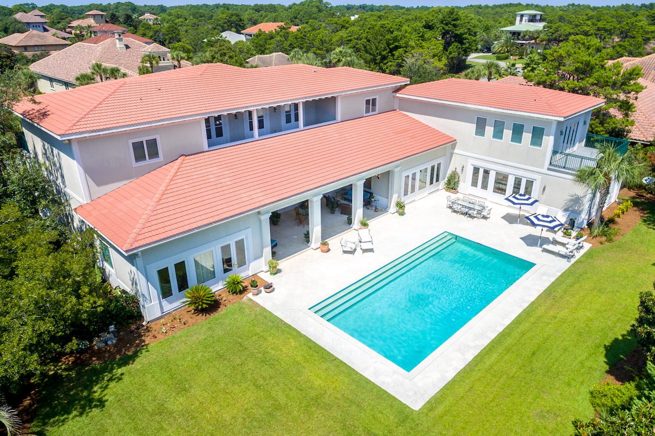 This luxurious coastal residence sits on a double lot in the desirable non-rental gated community of BellaMar along Scenic Hwy. 30A. With over 8,493sf, this 6 bedroom, 6.5 bath home allows for a large family to gather together, then escape to their own private suites at the end of the day. This one owner home was built with high impact windows and doors and the first level is all concrete construction. Large room sizes and 11' ceilings give this home a substantial feel, along with an elegant foyer with a grand staircase leading to the 2nd floor. An elevator services both levels of the home. The 2BR/2BA guest house w/office sits next to the Beverly Hills style 20x40 ft. saltwater pool.