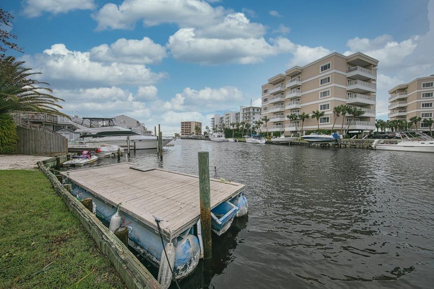 Durango Winds is a canal front small complex located on Holiday Isle just a short walk or bike ride to the beach. This spacious fully furnished townhome has an 18 foot ceiling in the living area. There are  2 master bedrooms with dual vanities in both bathrooms and walk-in closets. Loft bonus area is currently being used as an office but could be used as a 3rd bedroom. Gas fireplace and stove is a plus. Enjoy lounging and cookouts on your private deck or call for the water taxi to take you to Harborwalk Village or any of the amazing restaurants along the harbor. Priced to sell quickly so schedule your showing today!