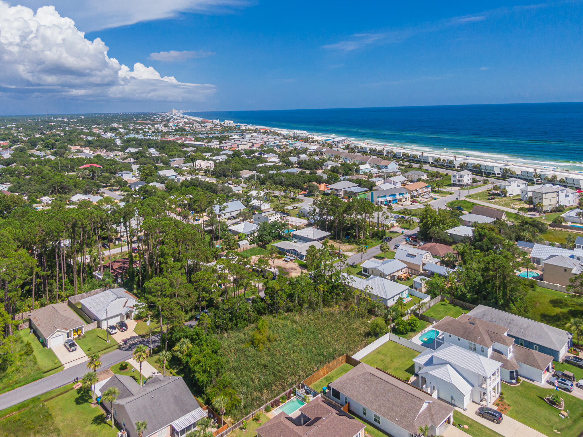 This vacant .126 acre (50'x110') residential lot in the highly desired west end of Panama City Beach is a true builder's delight for the fishing and water enthusiast is just a walk or golf cart ride block away from the beach. Located in the smaller established neighborhood of Inlet Beach Heights, just north of the closest public beach access, for you or your guest's enjoyment. This access is just west of the southern end of the street.You have fast and the better access to the infamous 30A beach road that accounts for many of our upscale beach communities in the area, such as Rosemary Beach, Alys Beach, Seaside, WaterColor and more. Situated here at home, your also just a few minutes away from Lake Powell, which has been a great source for kayakers and taking out the paddle board and fishing. There are nearby public boat ramps, shopping, dining, grocery, drug stores, banking, coffee house, medical facilities, beach stores, outdoor concert/green space areas and more. Publix anchored Ocean Park Pavilion shopping center almost across the street offers a variety other very convenient dining and retail establishments "near home".
You will find Popular Pier Park and much, much more is only 7 miles east with the Panama City Beach airport is only 17 miles away, which is one of the easiest and fastest ways in and out of our area for tourists and for your traveling needs. Not, to mention with that convenient and easy access, our beaches are some of the cleanest near your new home, second home or vacation home! Hospitals for emergencies, are about 20 miles in either direction of the lot.
This lot has an available 2018 boundary survey, is in flood zone X, AE and has wetlands and needs and does have required permit from the Florida Department of Environmental Protection (DEP) which extends until November 2023 (extendable & transferrable) to clear, fill and build within its regulations and is transferable within 30 days of closing.
In regards to the authorization stated needed on the permit, the seller has stated it wasn't needed because of being in a platted subdivision. The onsite wetlands may not be jurisdictional and a Section 404 fill discharge Corps permit may not have been required. Per US Army Corp of Engineers: In December the FDEP assumed permit authority of Section 404 fill discharge permits for areas including the subject parcels. Therefore, please contact the FDEP if you desire a jurisdictional determination or for further Section 404 fill discharge permitting.
Zero HOA fees nor the hassle of an HOA, the original subd. CC&R's may be expired so it may just the requirements in the permit, in addition to other potential county, state and local municipality regulations.
To be cleared, fill and built the permit applies to BOTH LOT 16 & 17, can't do separately or one at a time.
The tap fee hasn't been paid on the lot and sewer is available and across the street, boring required as well as a lift station. Homesite 217 has completed this process for an example.
Seller is not accepting contracts with a due diligence period, they are wanting that completed and waived before contract.