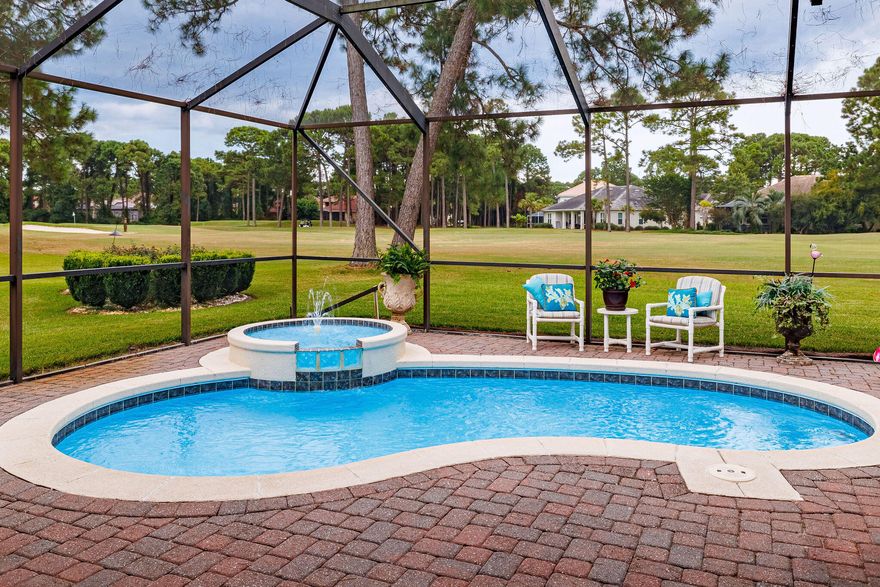 Seller Motivated .........This beautiful renovated one-level  ranch home has 3 bedrooms, a split bedroom floor plan,  and  3 full baths.   The home has great street appeal with a large circular pavered driveway  with a beautiful large water fountain in the center. The VERY open concept layout is light and airy. It is located on the 4th fairway which provides fabulous views of the renowned (Jack Nicholas designed ) Emerald Bay 18 hole Golf Course.   Entering into the gated community you immediately have views of the lush green fairways/greens of 6 separate holes and five ponds plus the impressive golf club house. Immediately entering the home you view the beautiful large lanai  (including a beautiful heated pool & jacuzzi)  and the  golf course fairway which brings the outside in which brings the outside in.....  The family room with walls of windows, along with 2 doors leading out to the lanai, has fabulous views of the lanai/pool and golf course.  The kitchen adjoins the family room which is totally open to the lanai/pool and golf course. The kitchen and all 3 bathrooms have granite counter tops.  The kitchen includes a surround counter top bar which  seats 7++.    The large primary bedroom has an en-suite bathroom with double vanity which provides significant storage space and  2 walk-in closets. There is a large walk- in shower and a large jacuzzi tub. The primary bedroom includes walls of windows and French doors which overlook the  lanai/pool and golf course.  Plus there are  2 unique and beautiful block glass windows which provides lots of light. The home has 10 foot ceilings with beautiful crown and base molding throughout. The 2 car garage has lots of shelving and storage and includes an expanded area for housing items such as lawnmower, tools, bicycles or even a motorcycle.  The garage floor has been recently expoxed.  Home has natural gas generator.   
 
This immaculate and very impressive home plus the beautiful golf course are a MUST see!

The Emerald Bay community has one of the most reasonably priced HOA's in the area with a fee of only $77 per month. Emerald Bay has a gated secured entry, community swimming pool, tennis courts and a guest house (which can be rented for large gatherings or for out of town guests), and a clubhouse with a full-service bar and grill.   In addition, the golf course offers optional memberships to one of the most popular and entertaining golf courses on the Emerald Coast!   The neighborhood itself is known for its lush landscaping, quiet streets, and a sense of community. Beyond the community's borders, you will find sugar-white pristine beaches, world-class shopping and dining, many entertainment options, excellent schools which makes this location a true paradise for those seeking the quintessential Florida lifestyle.  You will love this home and community.
