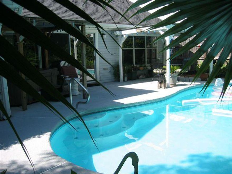 Beautiful one story home right off Airport Rd in beautiful Destin FL, 1.8 miles from the white sands of the Gulf. 1753 sq. feet, pool, 3 br, 2 ba, office/dining. Exotic and very private landscaping, 12 foot ceilings in living and kitchen, vaulted ceilings in 2 bedrooms, security system, 2 car garage. Granite counters in kitchen and both bathrooms. Upgraded light fixtures, faucets, and comfort level toilets with soft touch close seats. Digital entry lock with key override. Motion sensor front door light. Dusk to dawn landscaping lighting. Privacy fence around back. Flood insurance not required. Outdoor sitting room. This house has been well maintained and loved