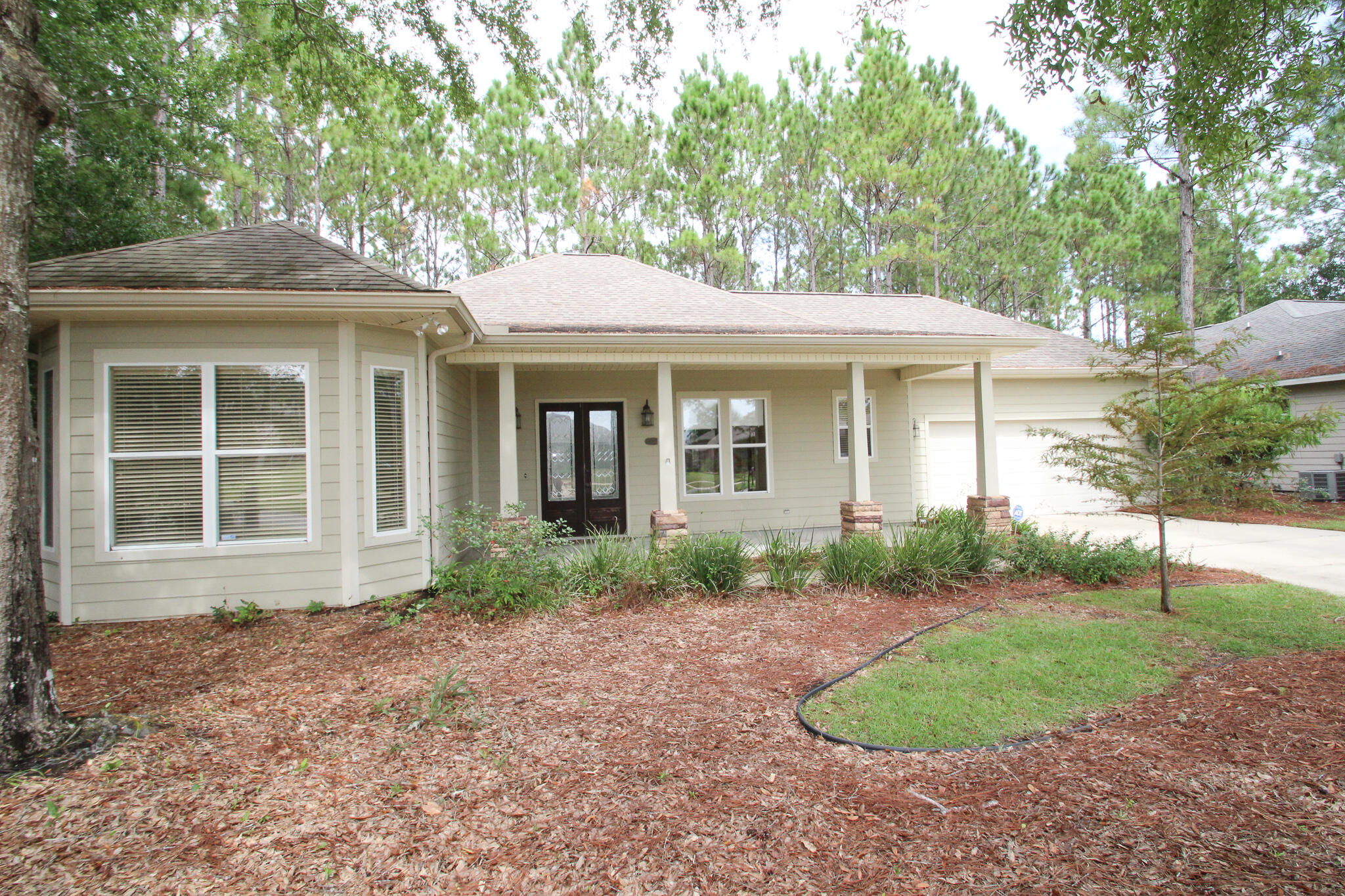This one-story Custom Built 3 bed/2.5 Bath home is a must see! Spacious open living room with stunning gas fireplace surrounded by custom built-in shelving. The kitchen features plenty of counter space, stainless appliances, granite countertops, gas stove, pantry and it opens to a charming breakfast nook with window seating. Oversized Primary bedroom has large walk-in closet with built-in shelving. Primary bath offers double vanity, separate tub, and custom shower. Oversized Screened patio to enjoy view of your back yard nature. Secondary bedrooms are at the front of the house sharing a bath. You also have half bath near the entry area for guest to use and beautiful formal dining room for Entertaining. Hammock Bay Is a planned community with world class amenities!