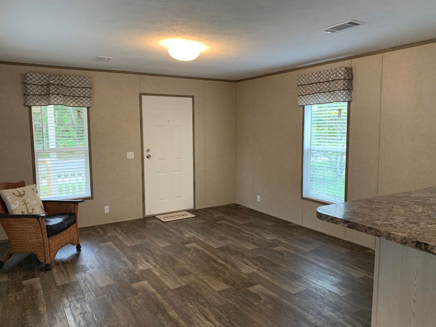 This newer Coastal Cottage 2 bedroom 2 bath open floor plan. 6 foot covered front porch. Stainless steel appliance with side by side refrigerator. Adbundant kitchen cabinets with a nice sized pantry. Private master bedroom with is own master bath. Vinyl flooring and window coverings throughout. Large lot with ample space to park a utility trailer, jet ski or boat.  Owner maintains landscaping twice a month. Home is unfurnished. No pets and no smoking is allowed in the home. Please apply at https://apply.link/3c6l4 www.rentspree.com