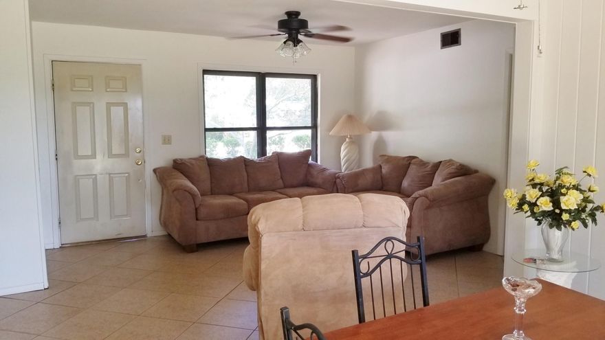 Back on the market. Great buy w/Open floor plan. Living room and dining area all tile. Kitchen is light and airy & features gas stove. Remodeled bath w/double vanity sink. Tiled walk-in shower with three shower heads & built in bench seats. Bedrooms have carpet & remaining areas have tile throughout the rest of the home. Two extra rooms would be great for office or playroom. Inside utility room for washer/dryer. Built-in shelving in living room. Spacious backyard has a 10x16 Workshop w/ electric plus 10x10 metal yard building for your extra stuff. Lawn pump & sprinkler system. This home also features a metal roof and no aluminum wiring.