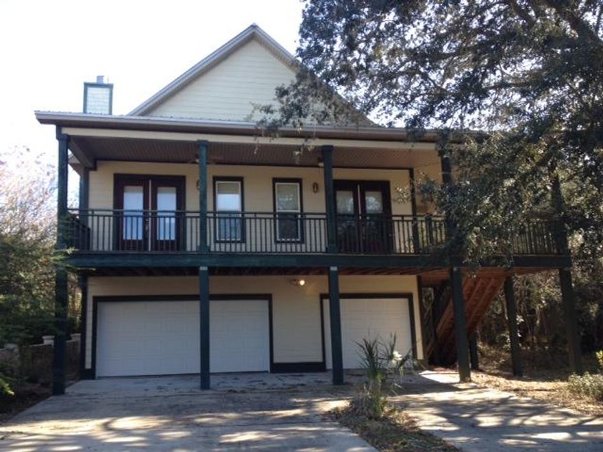 REO - Your wait is over! This 3 story home is located in a small gated community south of 30A on Eastern Lake. As you enter the home you will fall in love with the open living floor plan. Vaulted ceilings in the main living area and a fireplace. The kitchen is a chef's delight with granite counters, double ovens, huge breakfast bar, center work island with prep sink, tons of cabinet space and even a spot for a wine cooler. The master bedroom also features vaulted ceiling, access to the covered porch, tile floors and a large walk in closet that also has access to the laundry room. 2 additional bedrooms on the 3rd floor share a jack and jill style bath. The 33 x 50 garage is HUGE and can easily hold 4 cars and still have ample room for all your extras!