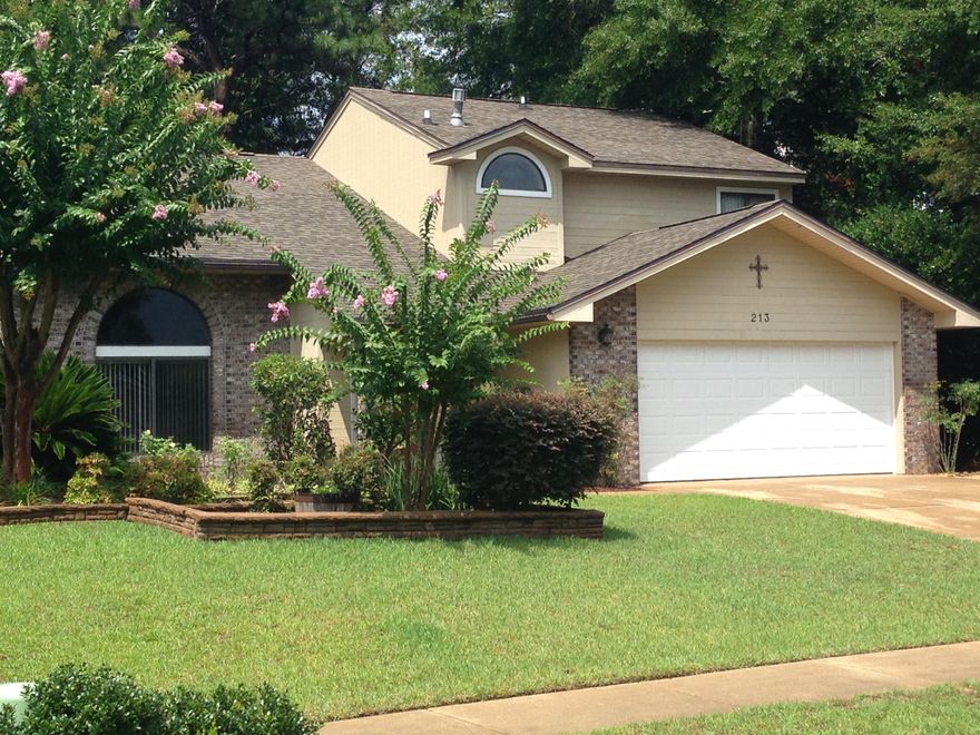 REDUCED AGAIN! Move-in ready! This home is immaculately clean and has been lovingly well maintained. Located in desirable Rockywood, this home is close to everything, yet tucked away in this small, quiet neighborhood. Lush landscaping makes for great curb appeal. Cathedral ceilings greet you as you enter and beautiful wood floors extend throughout. A pleasing palate of warm yet cheerful colors sets the tone of this place you'll want to call home. The separate family room overlooks the enclosed, tiled back porch and boasts an impressive fireplace that soars to the vaulted second story ceiling. A Tuscan feel welcomes you into the kitchen with quality appliances and designer fixtures along with a deep shadowbox windowsill. This 4 bedroom 3 bath home has so much to offer, both inside and out. Enjoy the gracious master bedroom on the 1st floor with great natural lighting and walk-in closet.  This is a true master bath with a garden tub, separate shower, double vanity, and finished with beautiful custom tile.  The ample 2nd story loft area lends itself to many uses and overlooks the family room and fireplace.  All bedrooms have generous closets and the same gorgeous wood floors. The upstairs bathroom also offers a double vanity, separate/toilet area, and is appointed with quality fixtures.
The double garage is clean and leads directly into the efficient indoor laundry room that is oversized and designed to accommodate a second refrigerator or freezer.  
Additionally, the owners have cultivated a yard that yields a variety of citrus and berries; not to mention the colorful flora and aromas that you'll enjoy while grilling underneath the pergola that is draped with beautiful mature wisteria.  Truly a backyard oasis complete with a bench swing and privacy fencing.  Call to see this clean, quality home today.(850)830-0273.