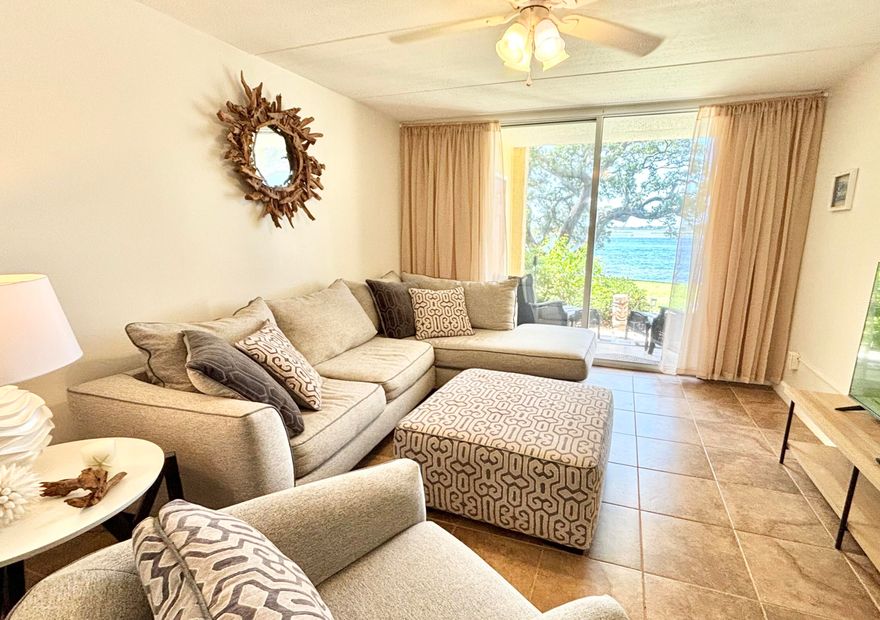 Waterfront - see dolphins from your livingroom ! Spacious two bedroom condo overlooking the water. Park like grounds with fishing dock, inground pool, picknick tables and kayak storage provided.The VA loan is assumable at 2.875% interest rate - if you qualify. Move in or use it for income as a vacation home, short term rental or long term rental.  Crab Island is 20 min by boat, Destin Harbor is 7 miles away ! Coastal life is within reach.