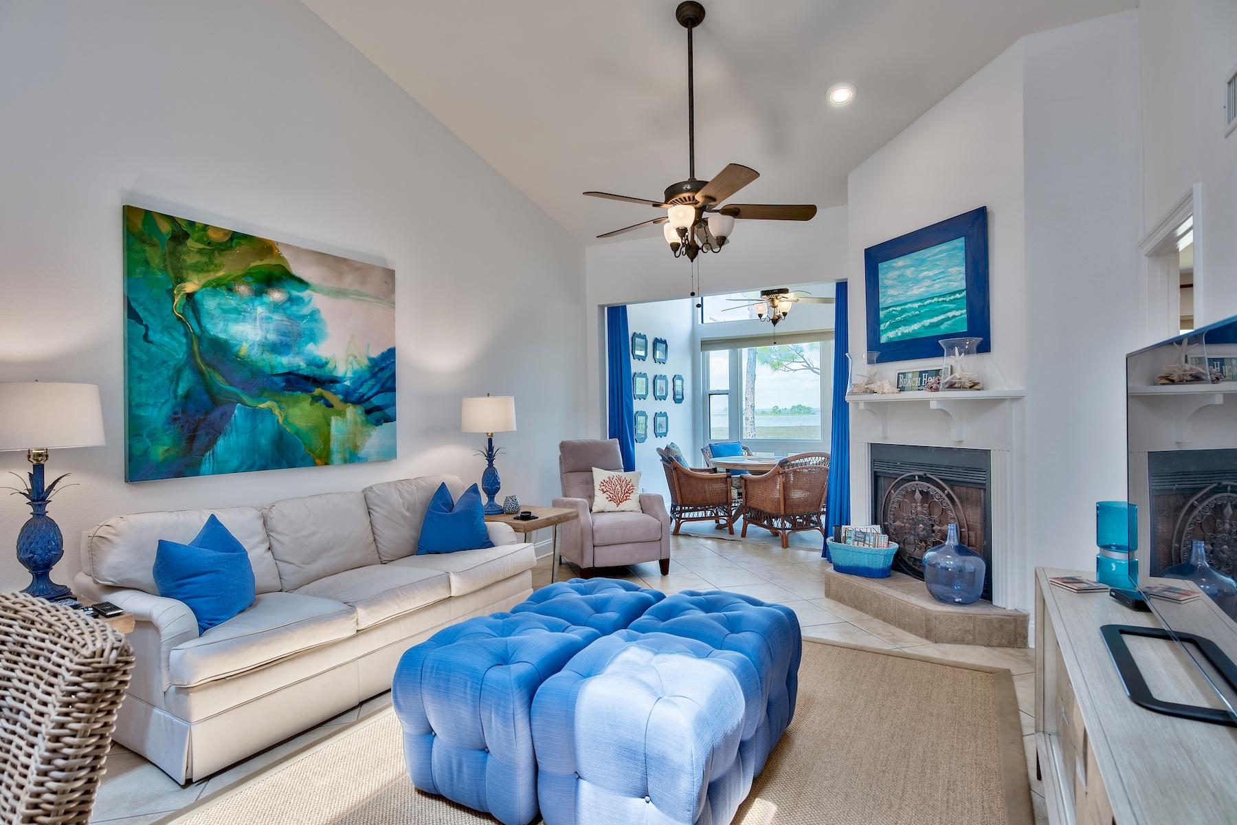 Primary contract in place with 72 hour kickout clause. Million Dollar Views! Fantastic views of Horseshoe Bayou and the Choctawhatchee Bay from almost every room in this condominium. Coastal colors of turquoise, navy and coral have been tastefully used throughout the professionally designed decor. Tile flooring is throughout the living/dining/kitchen areas with light wood laminate flooring in the bedrooms.The first level of living includes the fresh white kitchen with light blue glass tile backsplash, a dining area and spacious living area with a fireplace. Also included in this area is an enclosed Florida room set up for your family to enjoy puzzles, games or reading while gazing at the amazing view.