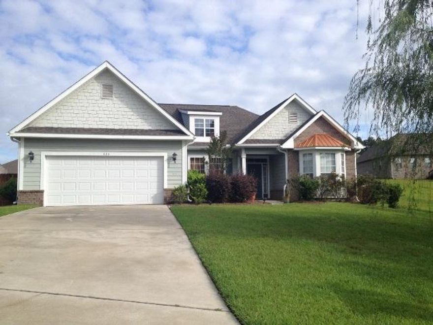 South of I-10 in Rolling Ridge Subdivision with curb appeal. This 4 bedroom 2 bath home is located in a cul de sac with a large lot. Large tiled foyer, formal dining room and split bedroom plan. Owners had the builder tile everywhere except the bedrooms. Kitchen has breakfast bar, pantry and all SST appliances that convey. Large master suite with trey ceiling. Master bath has garden tub, separate shower, large walk in closet and double sink vanity. French doors lead to the large fenced in back yard that has a custom deck for entertaining and above ground pool that will be removed. Wireless security system and sprinkler system.