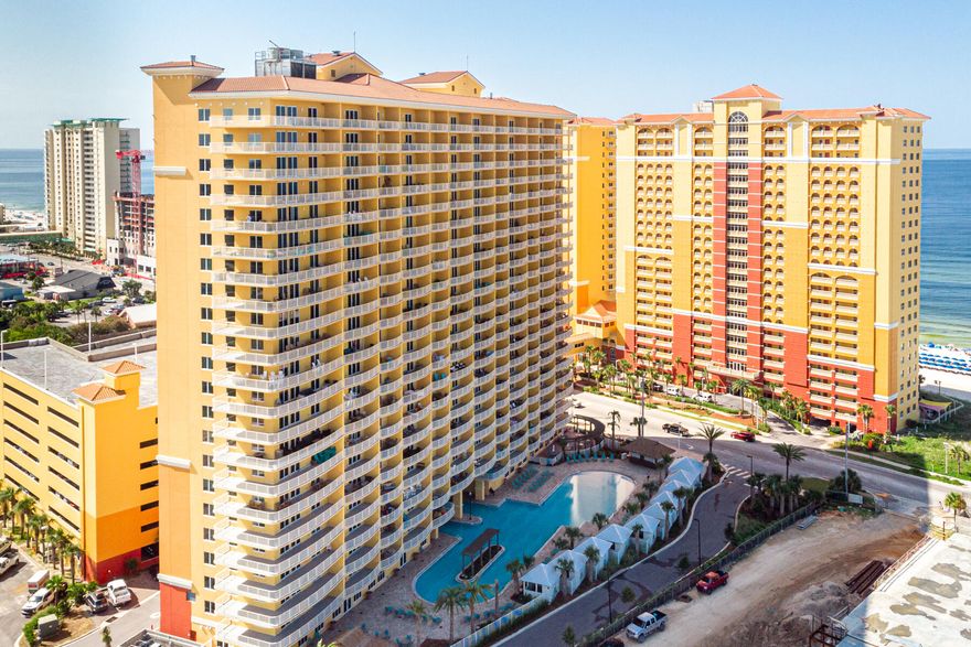 Adjacent to Pier Park and a quick walk to City Pier. Luxury interiors w/stainless-steel appliances, quartz counters, 9 ft. ceilings and 10 ft. wide balconies. Amenities include lagoon-style pool, fitness center, snack bar and parking garage. Unit 1003 is loaded with upgrades! Shiplap in hallway, living room and bedroom.  Beadboard in bathrooms. Upgraded lighting and fans. New cabinet hardware. Designer furniture.