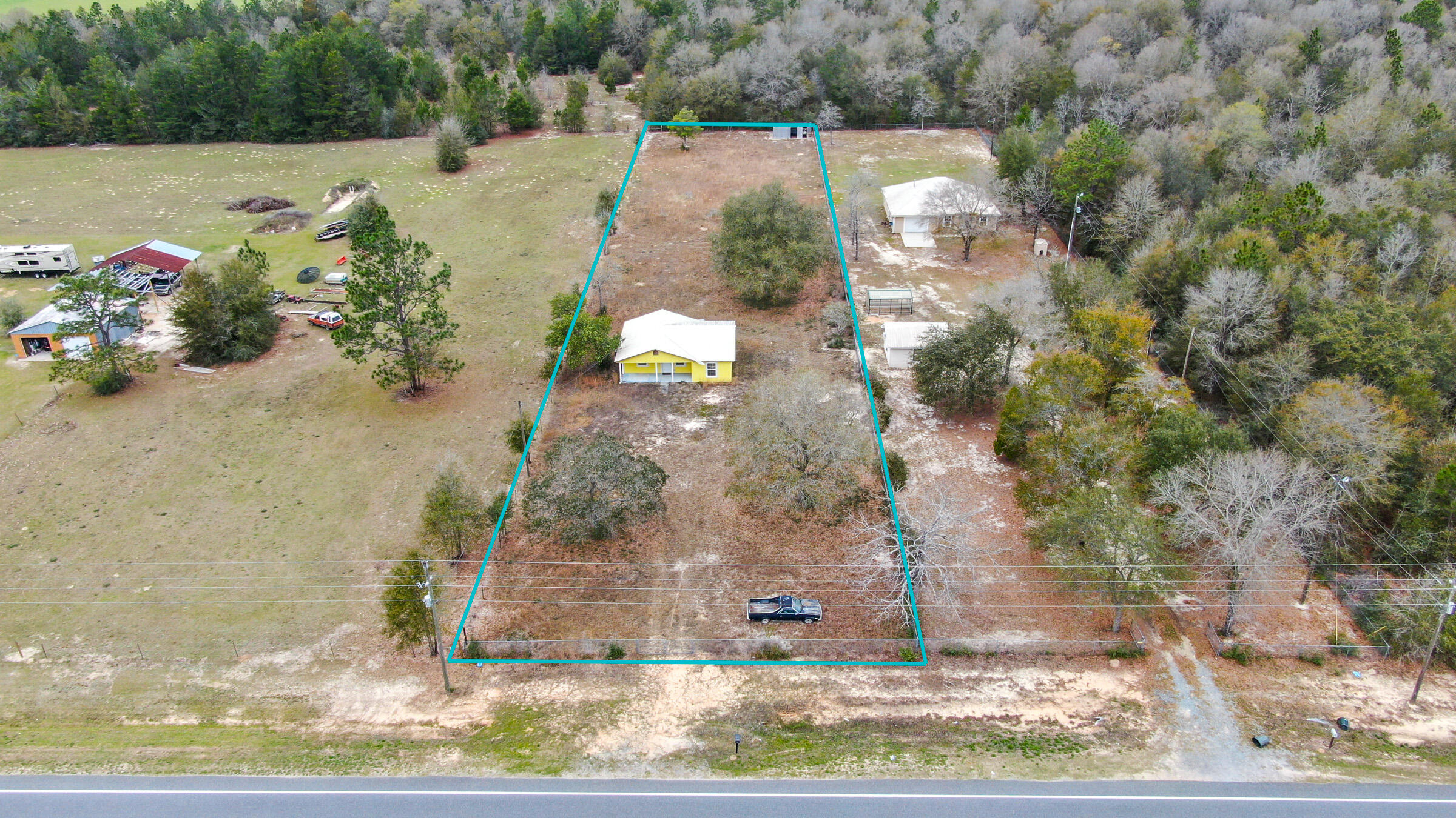 Partially renovated/completed 2 bedroom, 1 full bath cabin on 1+ acre in the growing Mossyhead area. Home has newer metal roof, HVAC, insulation, septic and new bathroom also. Still needs flooring & paint but has tons of potential. Exterior stucco siding is in very good condition. The entire lot is fully fenced with a shed at the very back of the lot. Cash offers only. Act quickly before this one is gone! House next door also for sale (3 bed/2 bath/1924 sf/ 1+ acre) - see MLS 884969.