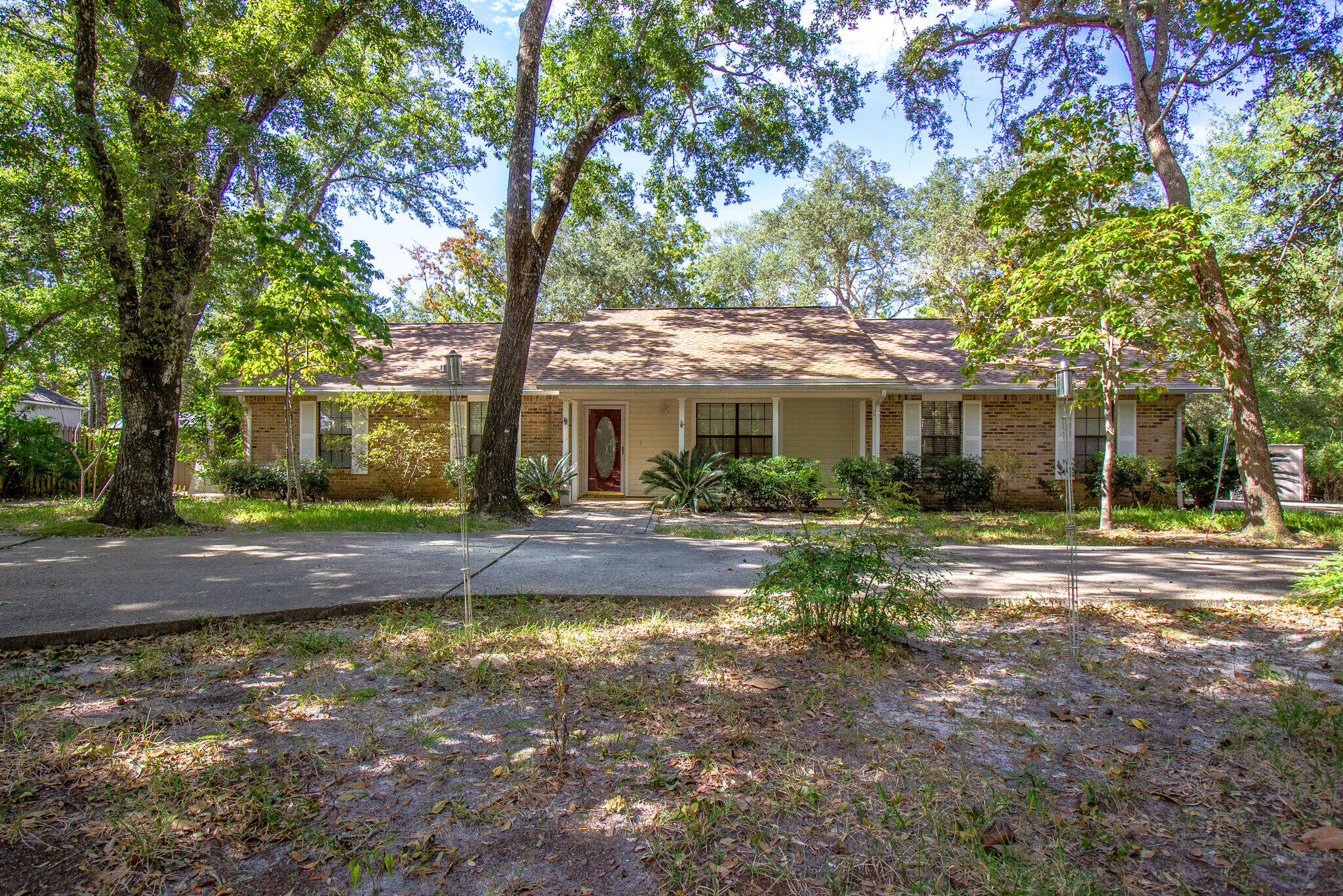 Very private 4 bedroom 3 full bathroom home on 1.3 acre lot backing up to natural wetlands. This home features two master suites, two living areas, two dining areas and multiple outdoor spaces to enjoy nature! The property includes the main house plus two out buildings with private decks; perfect for storage, a studio or anything else your heart desires. Additionally there is an oversized screened porch (31x15) along the back of the house. New flooring, fresh paint and even an updated kitchen make this your dream home! Pets may be allowed with management approval and $400 pet fee. Call to schedule a viewing today!