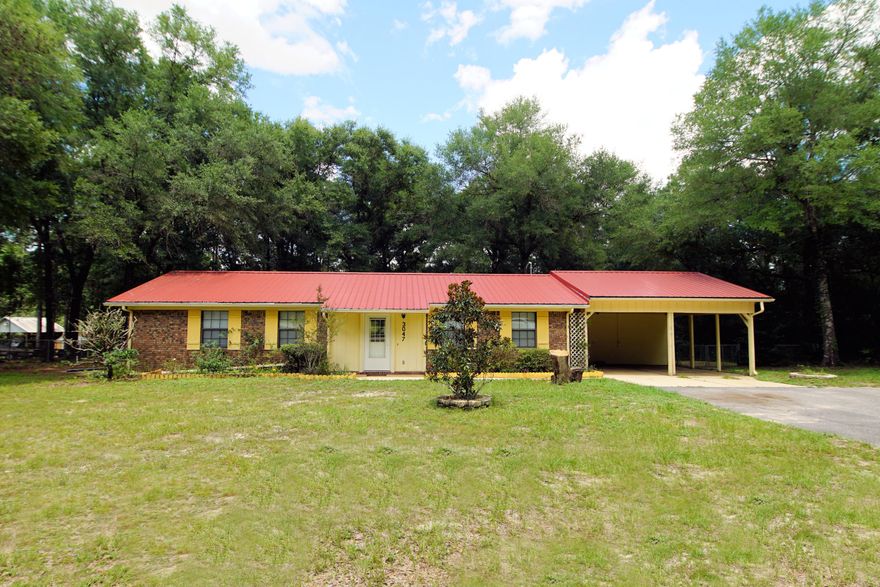 All Brick Home on almost 1 Acre in the heart of Crestview.2013 Metal Roof, 2002 HVAC, 2014 New Septic Tank, 3 Bedrooms and 2 Bathrooms, roomy living room, eat-in kitchen, laundry room inside,Tile Flooring thru out entire home, fenced yard, storage shed, carport. Did I tell you about the 24 x 24 MAN CAVE/Shop with 2 Garage Doors perfect for a Contractor to keep all your tools, four wheelers, jet skis, collector cars or lawn equipment secured. Come see this unique property..Schedule your private showing now to see this property in person as it wont last long!