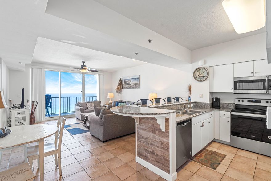 Step into your dream beachfront investment property at the Shores of Panama! This stunning one bedroom with a separate bunk room and two full bath condo boasts breathtaking views of the Gulf of Mexico. With over $40,000 in rentals already on the books for 2023, this condo is the perfect investment opportunity for those looking to maximize their returns. As you step inside, you will immediately notice the sleek and modern stainless steel appliances in the fully equipped kitchen. The living area is furnished with brand new furniture and coastal decor, providing a serene atmosphere to unwind after a long day at the beach. The condo has been freshly painted, creating a bright and airy ambiance throughout. The master bedroom features a comfortable king-sized bed, while the bunk room is perfect for children or guests with a large bunk beds featuring a queen on the bottom and twin on top. Enjoy your morning coffee or an evening cocktail on the private balcony, where you can soak up the stunning views of the Gulf of Mexico. Not to mention that this unit has a deeded parking space that conveys with purchase. As a guest of the Shores of Panama, you will have access to a range of amenities including a lagoon-style pool, a hot tub, a fitness center, and a spa. The property also features on-site dining options, so you can indulge in a delicious meal without having to leave the resort. Don't miss out on this amazing investment opportunity to own a luxurious beachfront condo at the Shores of Panama.