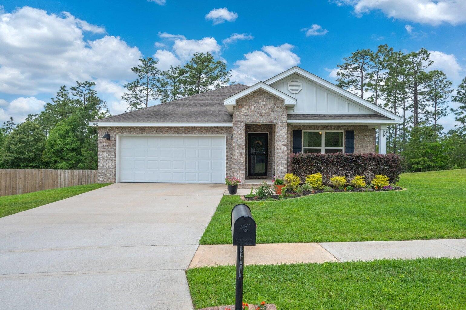 This better-than-new 2022 ALL BRICK home is move-in ready and packed with extras you simply won't find next door. Stainless steel fridge with water/ice dispenser included * Washer & dryer included * Tiled kitchen backsplash * Upgraded lighting fixtures and stylish vanity mirrors * Sleek Glass Shower Door in Primary Bath * Wainscoting detail in secondary bedroom * Beadboard detail in living room * ADT security system * Upscale drapery, rods, and faux wood blinds throughout * Abundant recessed lighting, even in the garage! * Ceiling fans in bedrooms & patio * Brand new carpet in all bedrooms * Beautiful landscaping & curb appeal.