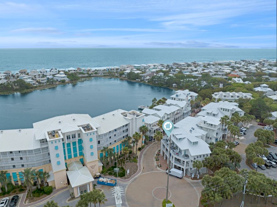 Escape to your own slice of coastal paradise in this charming 1 bed/1.5 bath Carillon Beach condo. Nestled just around the corner from the vibrant energy of 30A, this inviting space awaits your personal touch. Imagine relaxing on your large porch, a peekaboo view of the shimmering lake whispering of leisurely afternoons.  Inside, sunlight bathes the open floor plan and dreamy coastal retreat. With 830 sq ft of possibilities, this is your canvas for creating a sought-after vacation rental, second or full time home.Experience the luxurious Carillon Beach lifestyle, offering a blend of tranquility and coastal living. You'll enjoy world-class amenities including multiple accesses to uncrowded beaches with 3,900 ft of gulf font, several sparkling pools, Lake Carillon for kayaking or paddle