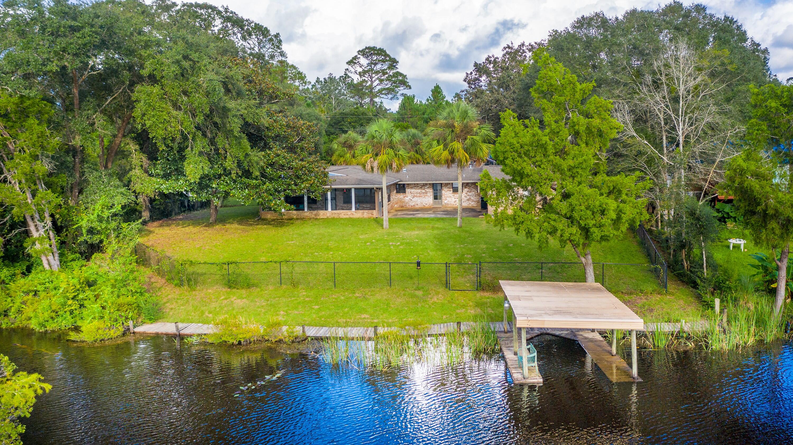 Waterfront Living! Your very own oasis overlooking Annie's Basin. Enjoy the beauty and peace of the birds, fishing and boating from your own dock. This charming home is surrounded by nature and designed for optimal views of the water and wildlife. Enter the home and instantly bask in the fantastic water views. Enjoy water views from the large open living areas or your kitchen window. Relax on your back porch and take in the gorgeous sunrises and sunsets sparkling off the water. Large patio is perfect for BBQ'S, gathering and cozy waterfront meals. Home has been upgraded with the owner's tender love and care, while keeping the charm and character of the time period when built. A must see to truly appreciate the potential and perks this rare and unique gem offers. Schedule your showing today