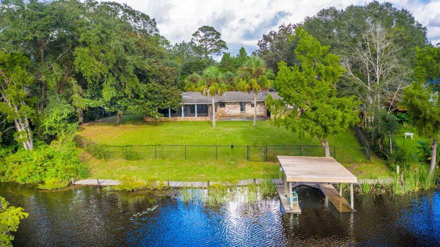 Waterfront Living! Your very own oasis overlooking Annie's Basin. Enjoy the beauty and peace of the birds, fishing and boating from your own dock. This charming home is surrounded by nature and designed for optimal views of the water and wildlife. Enter the home and instantly bask in the fantastic water views. Enjoy water views from the large open living areas or your kitchen window. Relax on your back porch and take in the gorgeous sunrises and sunsets sparkling off the water. Large patio is perfect for BBQ'S, gathering and cozy waterfront meals. Home has been upgraded with the owner's tender love and care, while keeping the charm and character of the time period when built. A must see to truly appreciate the potential and perks this rare and unique gem offers. Schedule your showing today