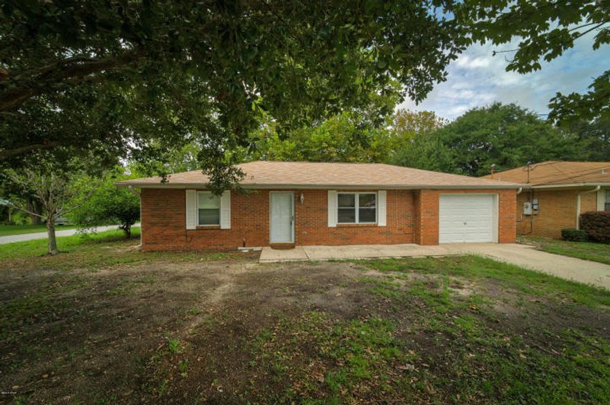 Wonderful ranch style brick home in the Lullwater Lake community. This home has so many great features such as a bright and airy layout with two large living areas, a large peaceful yard, fenced in back yard with storage shed and garden area, corner lot, sweet patio, across from Lullwater Lake and only blocks to the beach! Not only is the beach close but Pier Park has a sidewalk that leads here.