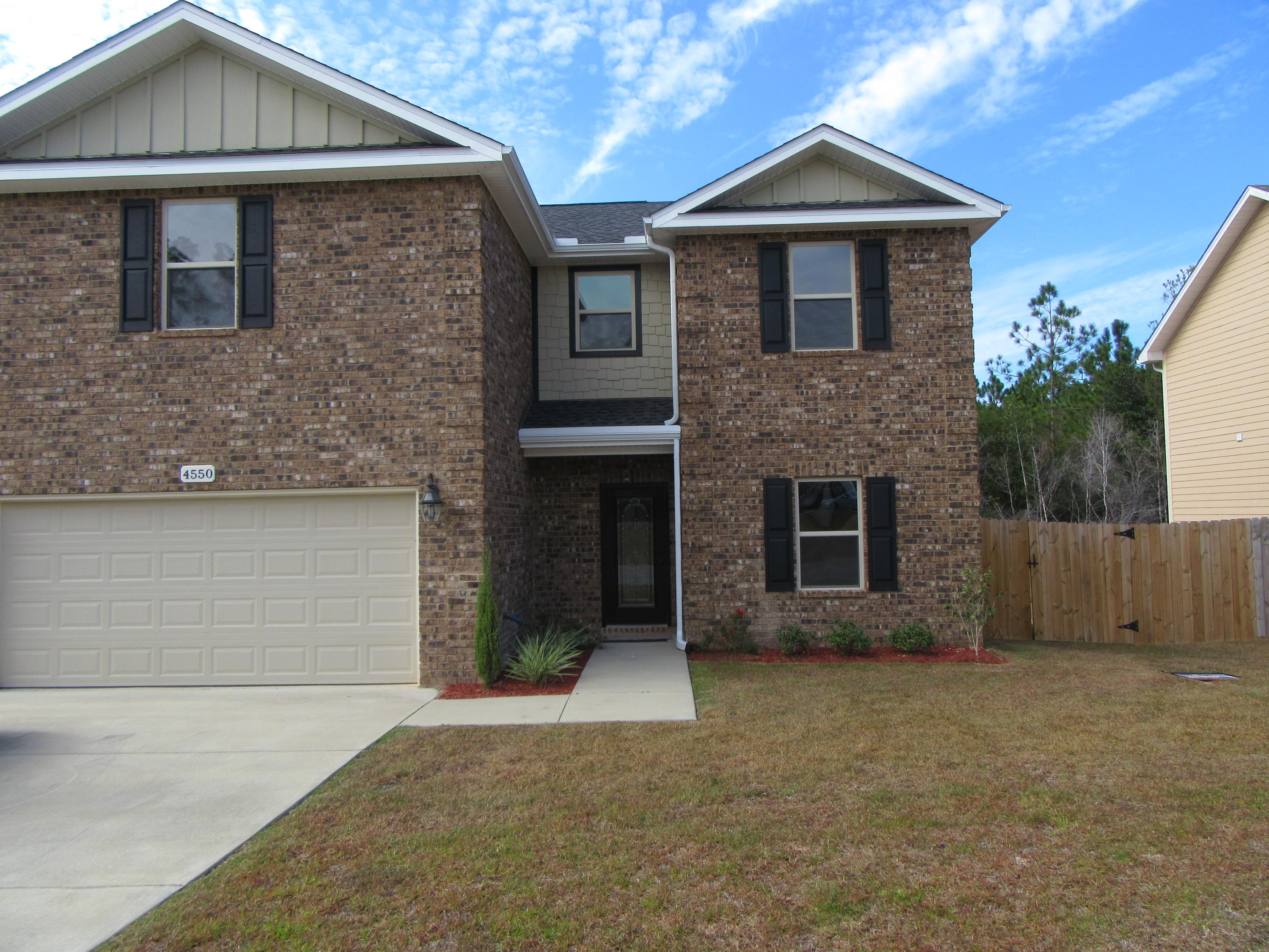 BEAUTIFUL CUSTOM NEW HOME VERY SOUTH OF I-10. 5 MIN. FROM 7TH SF & 15 MIN. FROM EGLIN. 4 BEDROOMS 2 1/2 BATHS. TILE FLOORING THAT LOOKS LIKE WOOD and 9' Ceilings. The peaceful downstairs living space consists of a study, a spacious living room looking out to wooded area in back of house, eat-in kitchen, half bathroom, closet and pantry. The kitchen, including breakfast bar, has maple stained CUSTOM cabinets, light colored granite counter tops, stainless appliances, and access to outdoor deck perfect for grilling and relaxing. Upstairs are 4 spacious bedrooms with large closets. Master bathroom is a haven with double vanities, closet, garden tub, and large tiled shower. There is plenty of storage space throughout the house. THE DECK IS BEING ENLARGED AND WILL BE COMPLETE NOVEMBER 15, 2016.