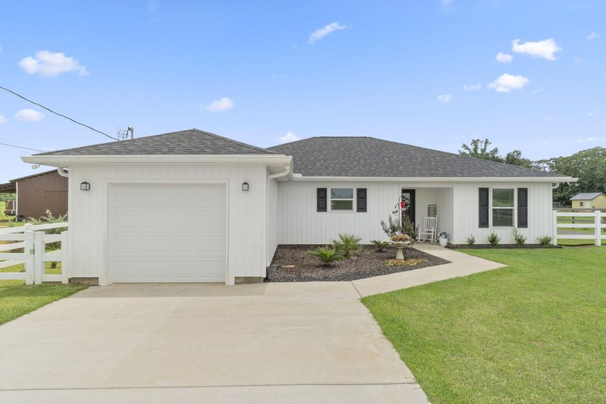 Welcome to this better than brand new 2023 build home in Jay, FL! This 3 bedroom, 2 bathroom, 1 car garage property is situated on a generous sized 1.57 acre lot - with plenty of room to spread out and enjoy the quaint, country lifestyle and beautiful natural view. Inside, you'll find luxury vinyl plank flooring throughout, and an open and split floor plan that seamlessly blends the eat-in kitchen into the living area. The kitchen boasts luxurious granite countertops, stainless steel appliances, and a wet kitchen island with 4 seater breakfast bar. The living room features a large double window with a gorgeous view of the expansive backyard, and a door leading to the covered patio. Down the hall by the kitchen is the interior door to the garage, inside laundry room, and the primary bedroom with ensuite - featuring a walk-in shower and FANTASTIC oversized closet. The 2 additional bedrooms and bathroom are on the opposite side of the home. The fully fenced in backyard has plenty of room to roam and makes the ultimate outdoor entertaining space! Featuring a newly installed shed and separate fenced in courtyard area - this could be your DREAM workshop, she-shed, man-cave, additional storage space, or whatever else your heart desires! Schedule your showing today, and make this home YOURS today!