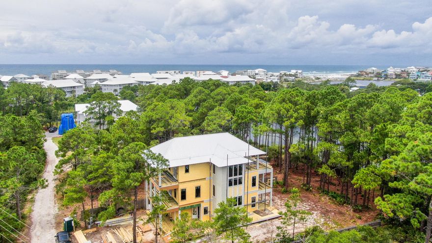 Gulf views and astonishing architecture exemplify this secluded waterfront Seagrove manor. Situated on Lake Tresca, this property offers peace and tranquility rarely found in the heart of 30A. Showcasing 5 bedrooms and 5.5 bathrooms, this home features a private pool; open concept living space; chef's kitchen; incredible outdoor living spaces; residential elevator; designer fixtures and luxury finishes. Located a short walk to the beach, have your toes in the sand within minutes. The well-thought-out floor plan is highlighted on the first level by the large open great room, first junior master suite, powder room and plenty of storage. Climb to the second floor to find a second living space, an additional guest suite, the second jr. master suite, bunk room and large laundry. The third floor