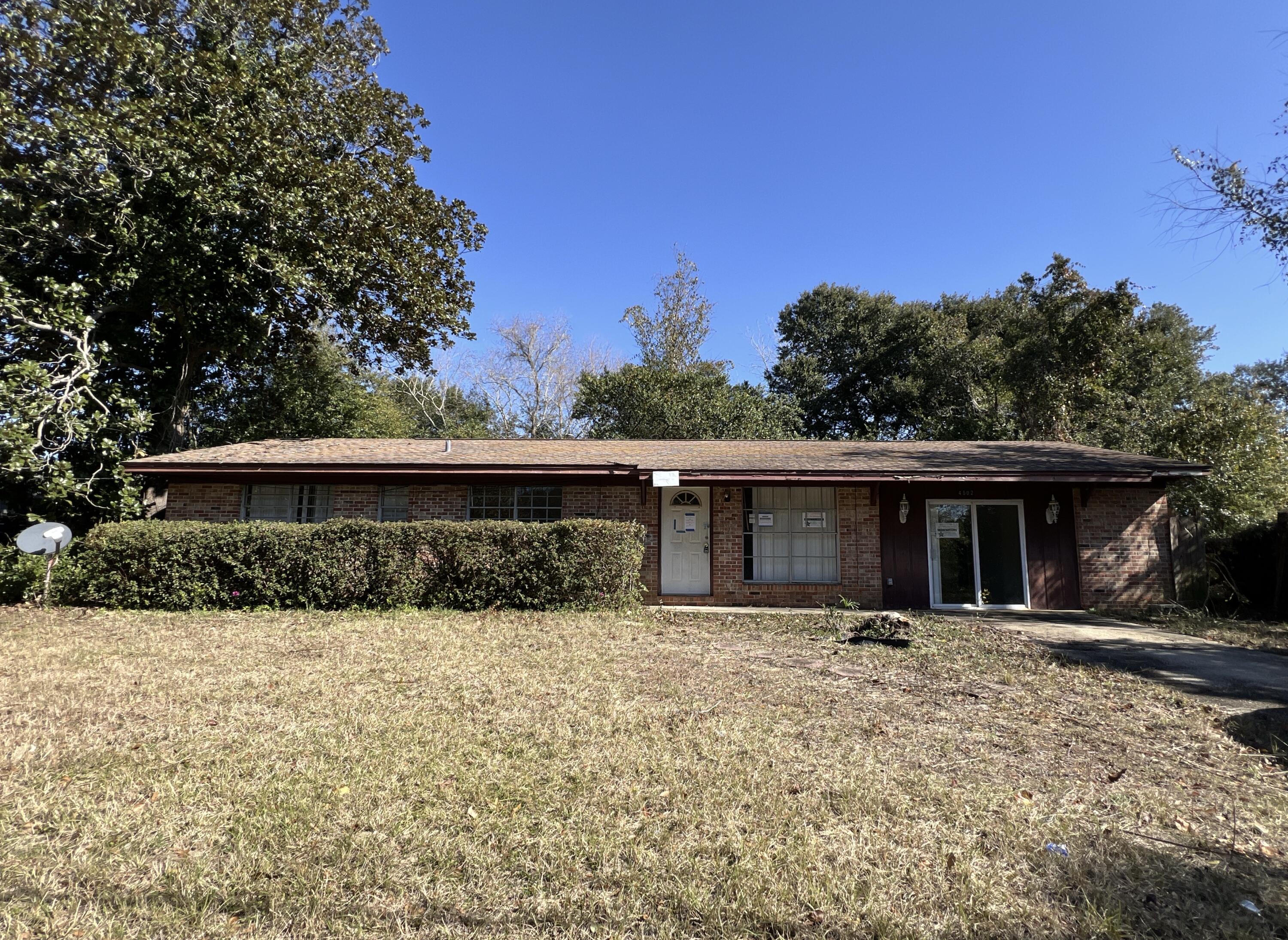 Built in 1965 and centrally located in the heart of Pensacola, this 3 bedroom 1 and 1/2 bath REO home is just a few miles from shopping, bases, churches and more. Block exterior with brick, this home has 1012 sf of living space; a fenced back yard, enclosed carport which gives extra living space and a galley kitchen. Home needs repairs and therefore will not qualify for financing other than FHA Rehab, construction loans, hard money loans.