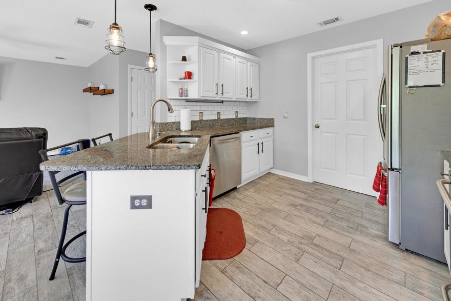 This four bedroom home is conveniently located within 5 miles west of the main gate of Hurlburt Field AFB. The  the main level lets you enjoy the open layout of the  kitchen, dining and living area. The kitchen has beautiful white cabinetry and granite counters with subway tiled backsplash. The huge sliders open up to a paver patio and large backyard. Upstairs you will find double doors that open into the primary bedroom with a large walk in closet. The primary bath has double sinks and plenty of storage. Separated by the secondary bath and hallway are the other three bedrooms. This allows plenty of privacy for the primary bedroom.  Roof is 2021, WH 2014,  HVAC Rheem 2015