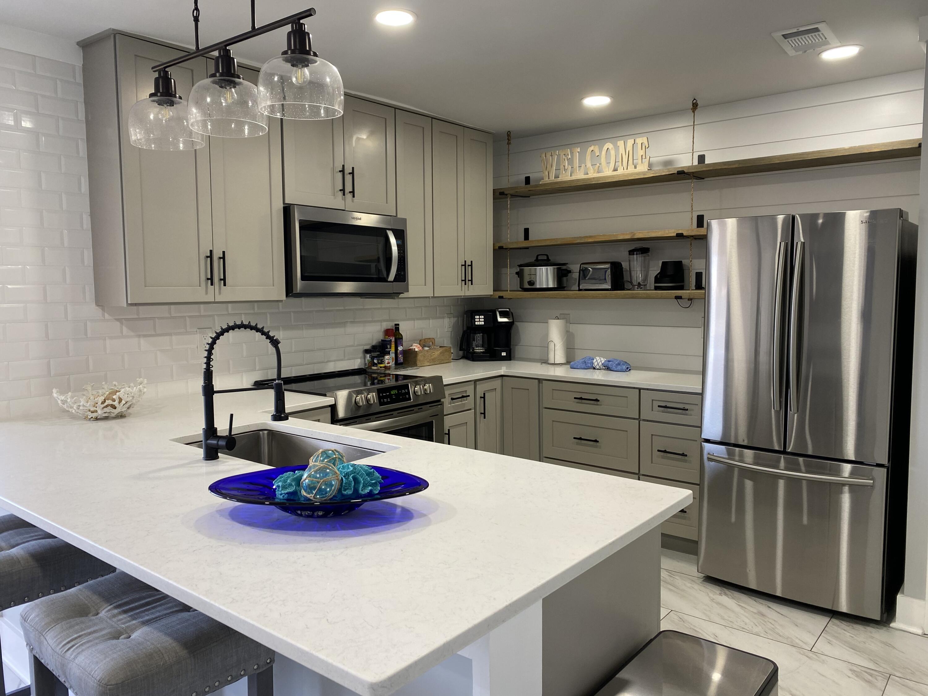 Completely and beautifully renovated condo in the heart of Destin! This condo is a rental machine! This elegant condo features shiplap walls, designer accent wall in the main bedroom, stainless steel appliances, a Murphey bed, quartz countertops and located on the lake and very close to one of three community pools, and tennis/ pickleball courts! This community is gated and close  to coffee shops, restraunts, ice cream shops, and the gorgeous beaches of the emerald coast!Sold Furnished!