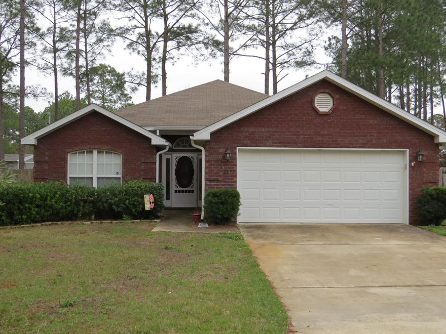 JUST LISTED Don't miss out on this great East Navarre 3/2 listing. Close to area bases and Pensacola. Enjoy QUIET COUNTRY living on this cul-de-sac in an upcoming developing area. Check out the open split floor-plan, SOLID WOOD custom cabinets in the kitchen are topped with elegant CROWN MOLDING. Newly installed Custom tile backsplash in kitchen. VAULTED ceilings greet you as you enter the massive Master Bedroom Suite. A soaking GARDEN TUB, separate shower and walk-in closet finish out your peaceful oasis. Two equally sized spare bedrooms and bath are off the front entry. Call today for your private showing.